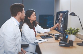 Doctors At Imaging Screen From Sectra