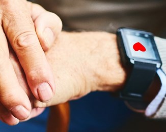 Smart watch on old person's hand