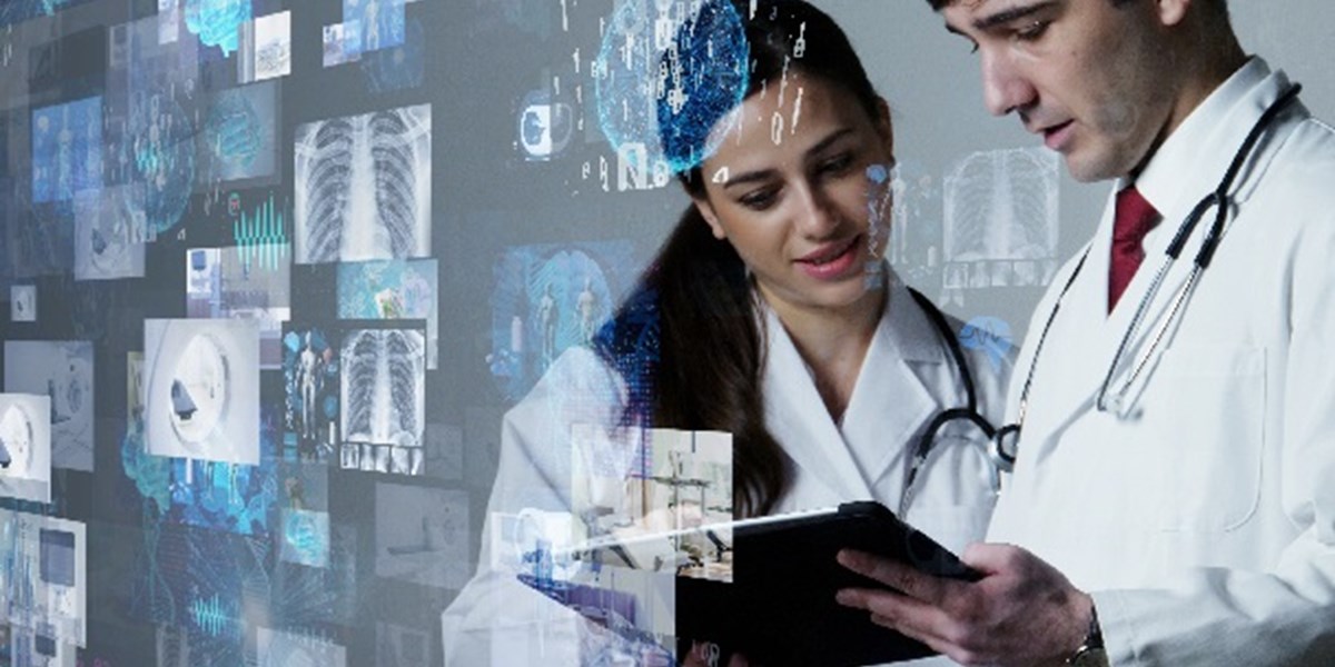 Medical images floating in front of two doctors